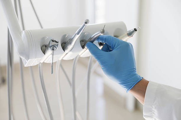 Professional Tooth Extraction technician working in Attleboro, MA